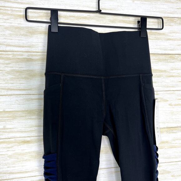 Athleta NWT Salutation Stash Pocket Twist II 7/8 Tight Black/Navy - Picture 4 of 8